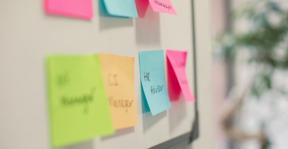 Multicoloured post stick notes on a board